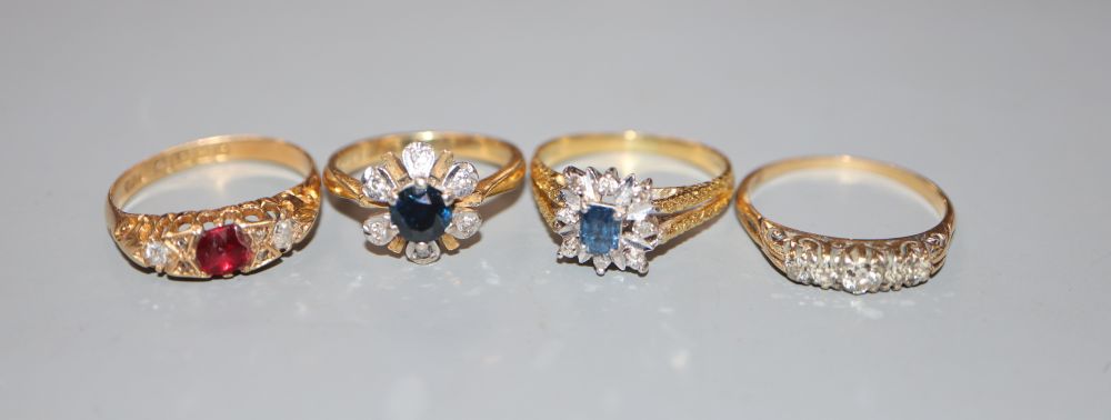 Four assorted 18ct gold and gem set dress rings